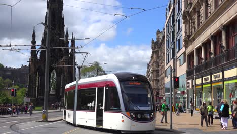 An-establishing-shot-of-a-tram-passing-on-the-streets-of-the-Edinburgh-Scotland