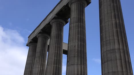 An-establishing-time-lapse-shot-of-the-Roman-columns-in-Edinburgh-Scotland-at-night