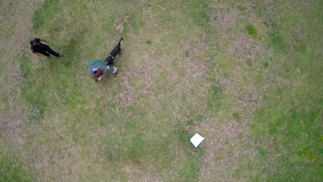 Aerial-view-above-a-K9-dog-in-training-attacking-trainer