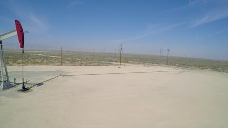 A-good-aerial-shot-beside-an-oil-pumping-derrick-near-Bakersfield-California-1