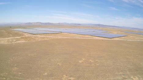 Aerial-over-a-vast-solar-array-farm-in-the-California-desert