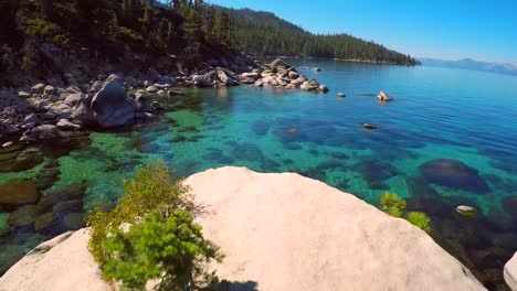 An-aerial-shot-over-beautiful-boulders-and-clear-water-in-Lake-Tahoe-Nevada-1