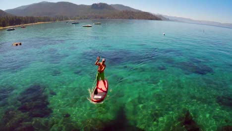 An-aerial-shot-over-a-paddle-boarder-rowing-on-Lake-Tahoe-3