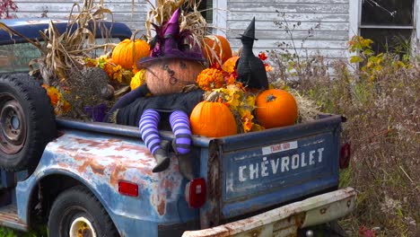 Autumn-or-fall-is-welcomed-in-with-a-homemade-Halloween-display-in-the-back-of-a-pickup-truck-