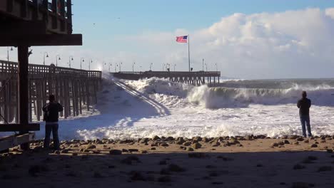 Huge-waves-crash-on-a-California-beach-and-pier-during-a-very-large-storm-event-11