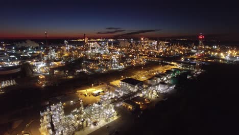Excellent-aerial-over-huge-industrial-oil-refinery-at-night-1