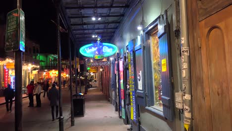 Tilt-down-to--an-establishing-shot-of-Bourbon-Street-in-New-Orleans-at-night