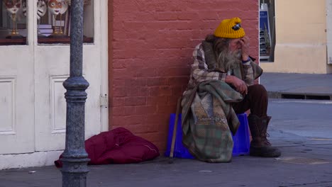 A-homeless-man-sits-on-the-street