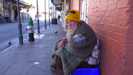 A-homeless-man-sits-on-the-street-2