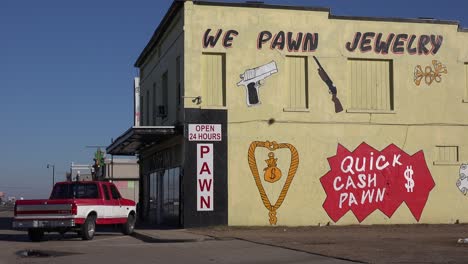 Establishing-shot-of-a-pawn-shop-with-a-sign-saying-we-pawn-jewelry""""