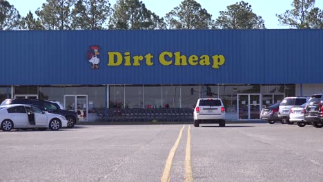 Cars-in-the-parking-lot-of-a-Dirt-Cheap-discount-store-1