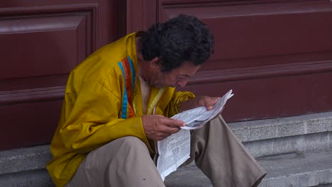 A-Cuban-man-reads-a-newspaper-on-the-streets-of-Havana