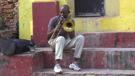 A-man-plays-the-trombone-on-the-streets-of-Havana-Cuba
