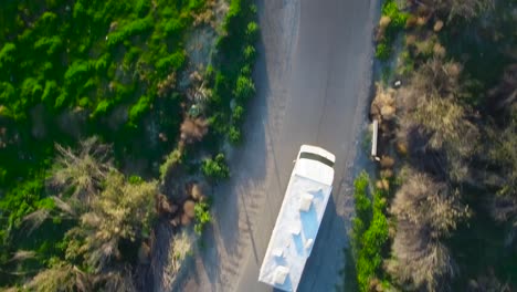 Aerial-directly-above-a-motorhome-traveling-on-a-country-road