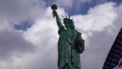 A-patriotic-shot-of-the-Statue-Of-Liberty-against-a-cloudy-sky
