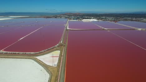 Aerial-footage-over-the-remarkable-red-and-white-salt-flats-in-the-Fremont-California-bay-area-2
