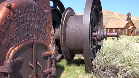 Rusted-mining-equipment-sits-on-the-ground-in-the-old-abandoned-ghost-town-of-Bodie-California
