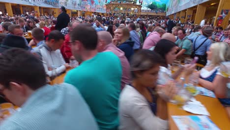 Traveling-shot-of-a-huge-beer-hall-at-Oktoberfest-Germany