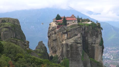 A-cable-car-moves-across-a-chasm-to-a-monastery-in-Meteroa-Greece-2