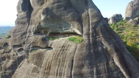 Beautiful-aerial-as-climbers-ascend-a-sheer-rocky-cliff-face-in-Meteora-Greece-2