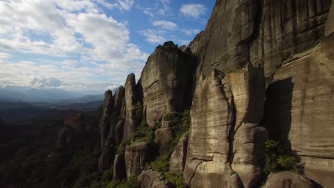 Beautiful-aerial-in-golden-light-over-the-rock-formations-and-monasteries-of-Meteora-Greece