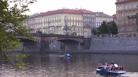 Paddleboats-move-on-the-Vltava-River-in-Prague-Czech-Republic-4