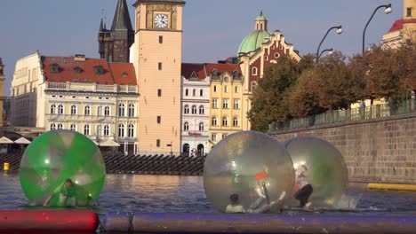 People-roll-around-inside-rubber-bubbles-on-the-Vltava-River-in-Prague-Czech-Republic