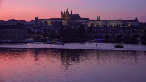 Beautiful-sunset-establishing-shot-of-shoreline-of-the-Vltava-River-in-Prague-Czech-Republic-1