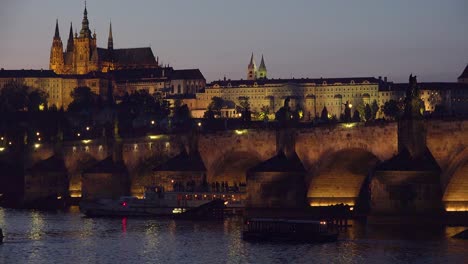 Beautiful-sunset-establishing-shot-of-the-Charles-Bridge-over-the-Vltava-River-in-Prague-Czech-Republic-1