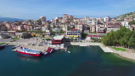 Nice-aerial-shot-of-the-resort-town-of-Sarande-on-the-coast-of-Albania-1