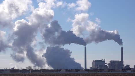 Huge-polluting-smokestacks-belch-CO2-into-the-atmosphere-suggest-pollution-carbon-emissions-and-global-warming-1