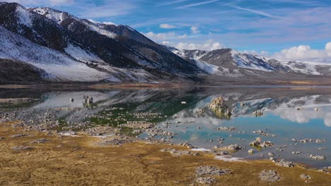 Beautiful-and-inspiring-nature-drone-aerial-over-Mono-Lake-in-winter-with-perfect-reflection-tufa-outcropping-in-the-Eastern-Sierra-Nevada-mountains-in-California-3
