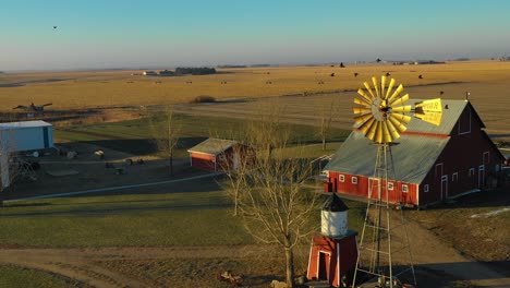 A-drone-aerial-establishing-shot-over-a-classic-beautiful-farmhouse-farm-and-barns-in-rural-midwest-America-York-Nebraska-1