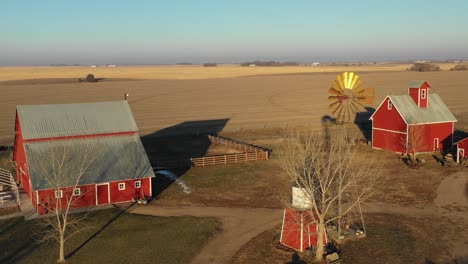 A-drone-aerial-establishing-shot-over-a-classic-beautiful-farmhouse-farm-and-barns-in-rural-midwest-America-York-Nebraska-2