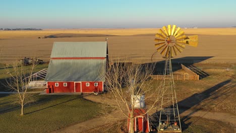 A-drone-aerial-establishing-shot-over-a-classic-beautiful-farmhouse-farm-and-barns-in-rural-midwest-America-York-Nebraska-3