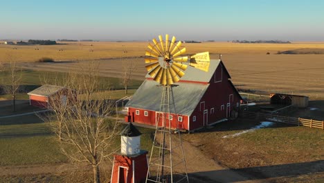 A-drone-aerial-establishing-shot-over-a-classic-beautiful-farmhouse-farm-and-barns-in-rural-midwest-America-York-Nebraska-4