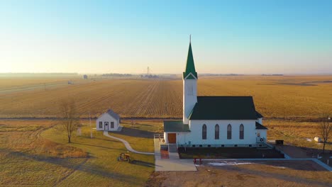 A-drone-aerial-establishing-shot-over-a-classic-beautiful-farmhouse-farm-and-barns-in-rural-midwest-America-York-Nebraska-5