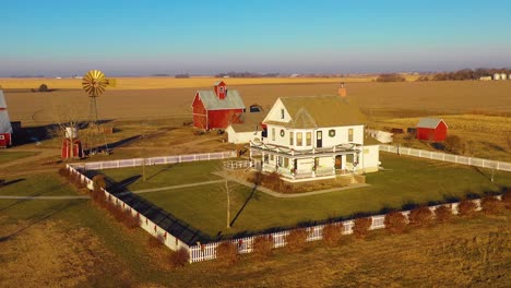 A-drone-aerial-establishing-shot-over-a-classic-beautiful-farmhouse-farm-and-barns-in-rural-midwest-America-York-Nebraska-9