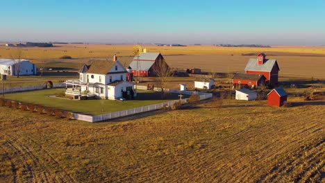 A-drone-aerial-establishing-shot-over-a-classic-beautiful-farmhouse-farm-and-barns-in-rural-midwest-America-York-Nebraska-10