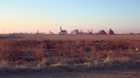Establishing-shot-of-a-classic-beautiful-small-town-farmhouse-farm-and-barns-in-rural-midwest-America-York-Nebraska