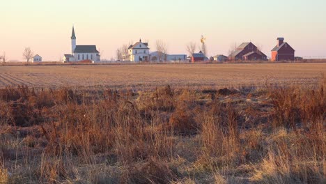 Establishing-shot-of-a-classic-beautiful-small-town-farmhouse-farm-and-barns-in-rural-midwest-America-York-Nebraska-1