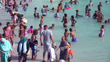 A-crowded-and-busy-holiday-beach-scene-at-Camps-Bay-Cape-Town-South-Africa