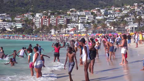 A-crowded-and-busy-holiday-beach-scene-at-Camps-Bay-Cape-Town-South-Africa-1