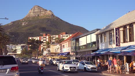 Good-establishing-shot-of-road-through-Camps-Bay-Cape-Town-South-Africa-with-cars-and-tourist-traffic-1