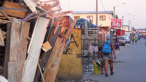People-pedestrians-and-cars-on-the-busy-downtown-streets-of-a-South-African-township-ghetto-or-slum-Gugulethu-2