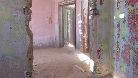 Sand-blows-through-an-abandoned-building-in-the-gem-mining-ghost-town-of-Kolmanskop-Namibia-2