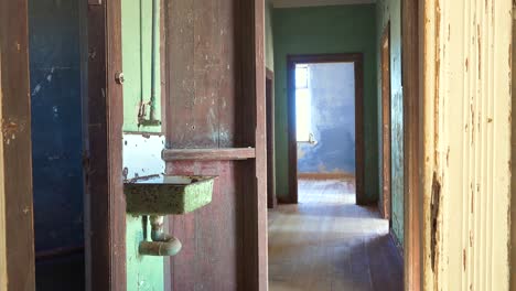 Colorful-walls-of-an-abandoned-building-in-the-gem-mining-ghost-town-of-Kolmanskop-Namibia