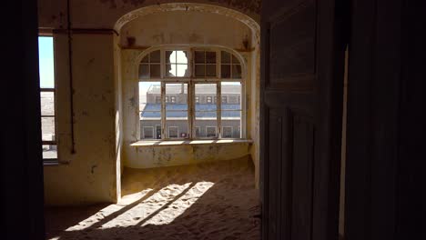 Sand-fills-an-abandoned-building-in-the-gem-mining-ghost-town-of-Kolmanskop-Namibia-6