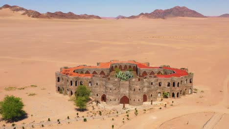 Aerial-of-the-spectacular-Le-Mirage-Resort-lodge-hotel-castle-and-spa-in-the-Sossusvlei-region-of-Namib-Desert-Namibia--2