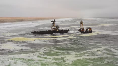 Dramatic-aerial-over-a-spooky-shipwreck-grounded-fishing-trawler-along-the-Skeleton-Coast-of-Namibia-2